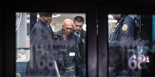 Weng Sor was escorted from a Brooklyn precinct Feb. 14, 2023, a day after allegedly killing one and injuring eight others in a rented U-Haul truck. 